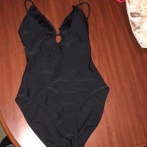 Black one piece bathing suit.